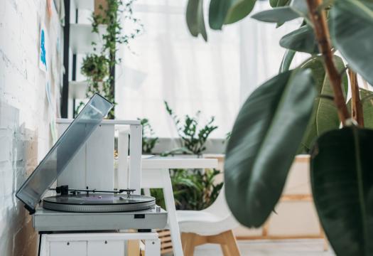 Records on a record player in a home.